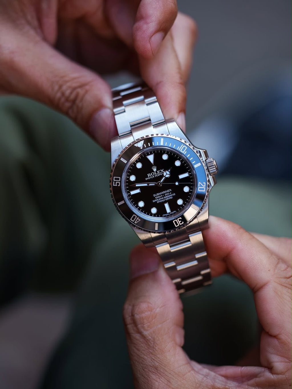 ROLEX SUBMARINE A BLACK DIAL AND BRUSHED STAINLESS STEEL OYSTER BRACELET AUTOMATIC WATCH