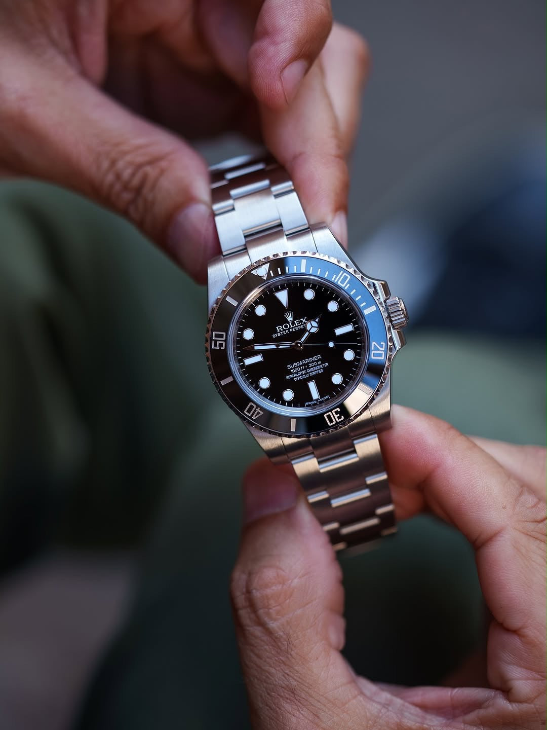 ROLEX SUBMARINE A BLACK DIAL AND BRUSHED STAINLESS STEEL OYSTER BRACELET AUTOMATIC WATCH