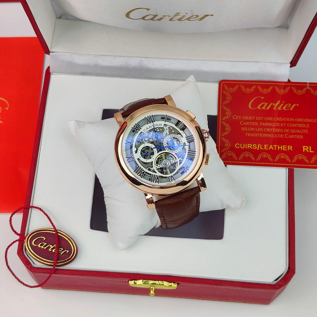 CARTIER A ROUND AUTOMATIC WATCH FOR MEN WITH A SKELETON DIAL AND BROWN LEATHER STRAP