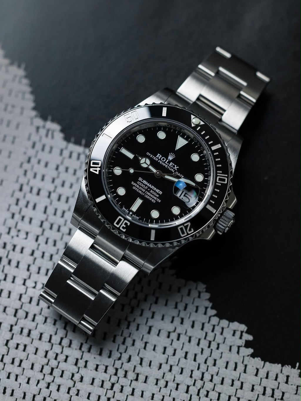 ROLEX SUBMARINE A BLACK DIAL AND BRUSHED STAINLESS STEEL OYSTER BRACELET AUTOMATIC WATCH