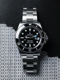 ROLEX SUBMARINE A BLACK DIAL AND BRUSHED STAINLESS STEEL OYSTER BRACELET AUTOMATIC WATCH