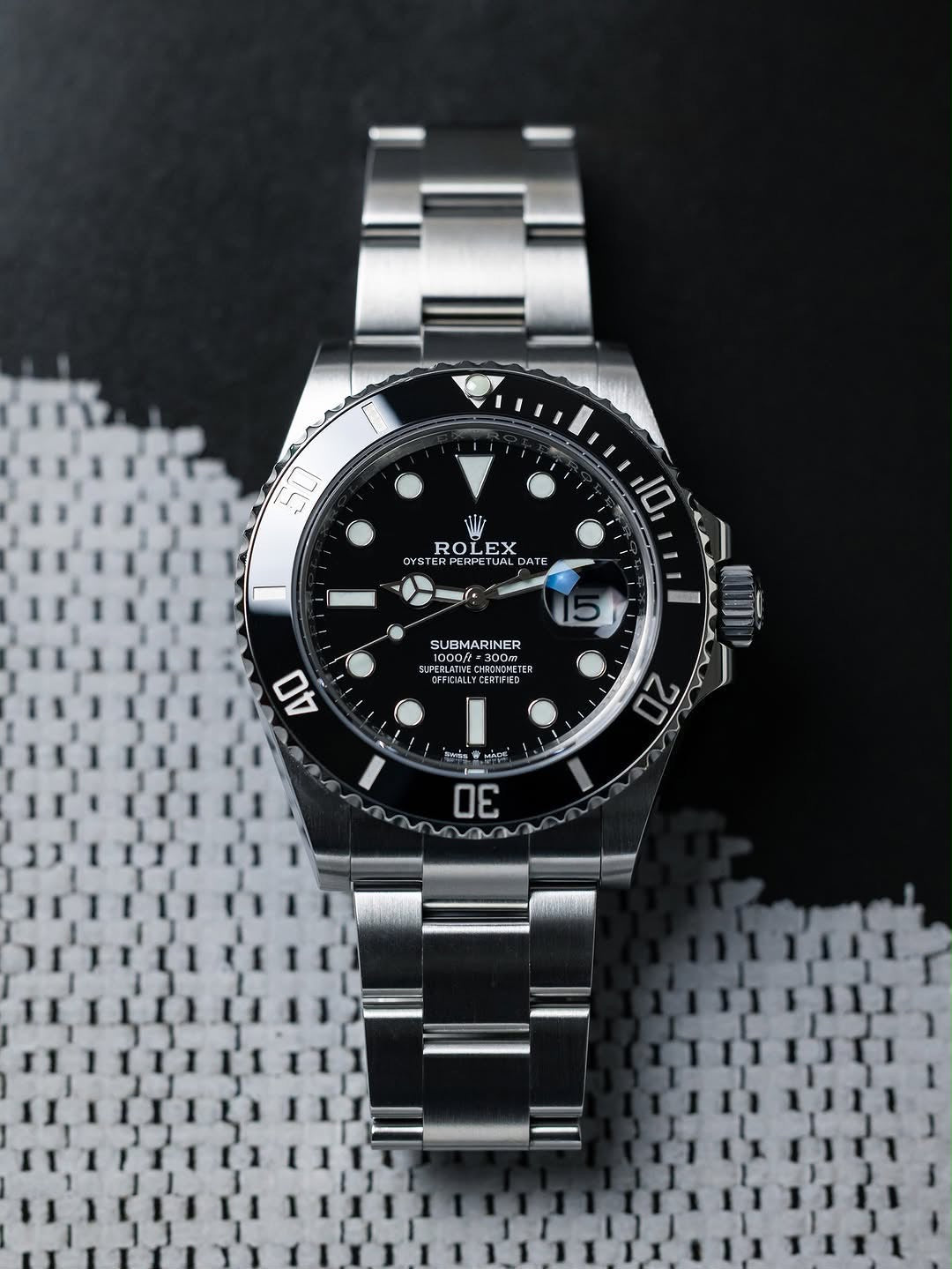 ROLEX SUBMARINE A BLACK DIAL AND BRUSHED STAINLESS STEEL OYSTER BRACELET AUTOMATIC WATCH