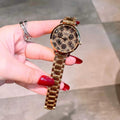 GUESS SUGARPLUM GOLD  J524